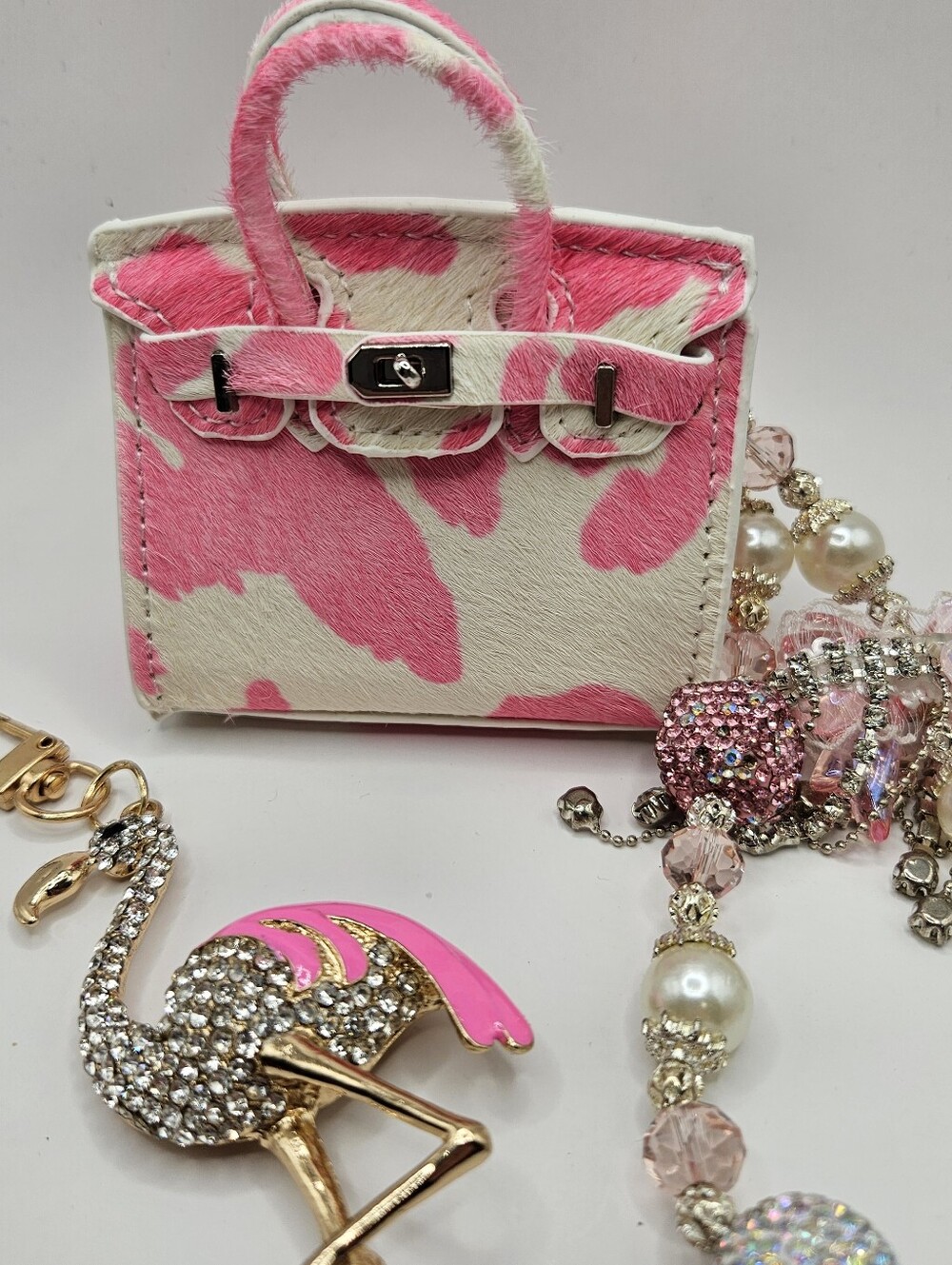 Pink and White Cowhide Minibag With Chain And Flamingo Charm